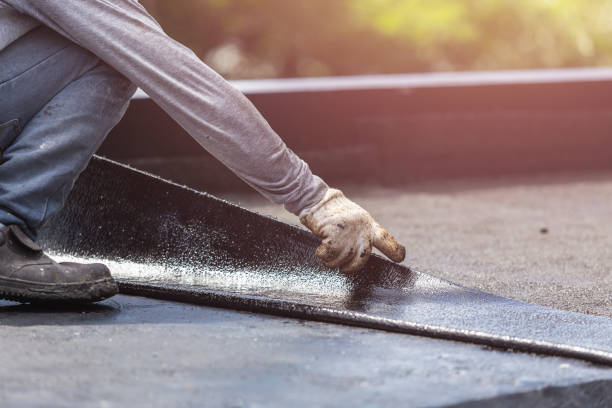 Professional Basement Waterproofing technician working in Irvington, KY
